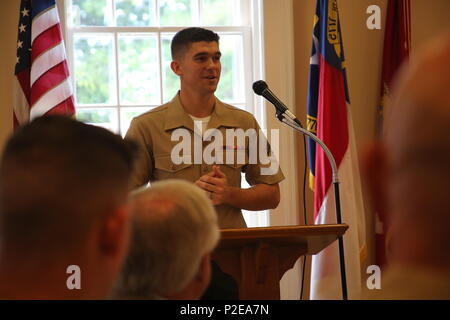 Cpl. Jared Hall delivers a speech during a reception at the New Bern Country Club in New Bern, N.C., Sept. 8. The Hall family received the Military Family of the Quarter Award during the reception. The family received awards, gifts, gift certificates and publicity from the Havelock Military Affairs Committee and the New Bern Military Alliance Committee in appreciation for their service. Hall is an aviation communications technician with Marine Air Support Squadron 1. (U.S. Marine Corps photo by Lance Cpl. Mackenzie Gibson/Released) Stock Photo