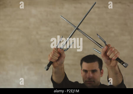 Kung fu fighter practicing with sword Stock Photo