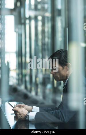 Businessman using mobile phone Stock Photo