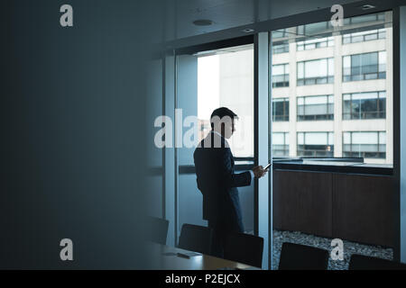 Businessman using mobile phone Stock Photo