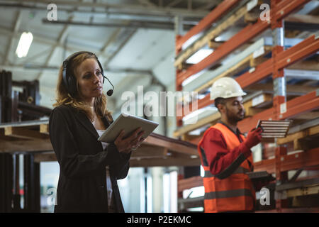 Female worker using digital tablet Stock Photo