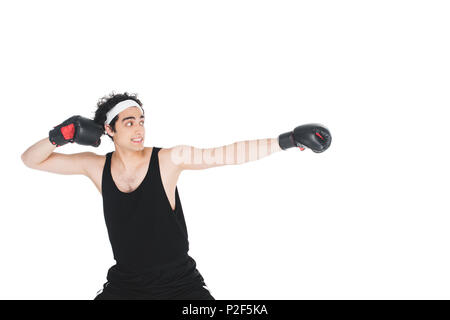 Young skinny boxer preparing to hit isolated on white Stock Photo