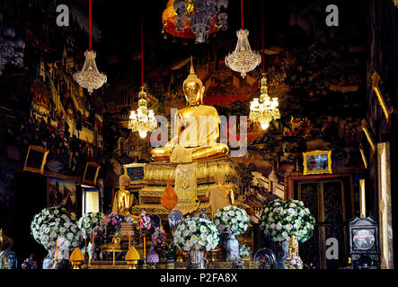 Golden Buddha statue in the hall of temple in Bangkok, Thailand Stock Photo