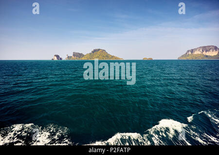 Cruise near tropical islands at sunny day in Andaman sea, Thailand Stock Photo