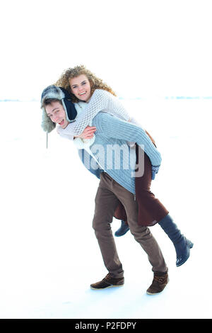 Man picking up woman in white monophonic background. Stock Photo