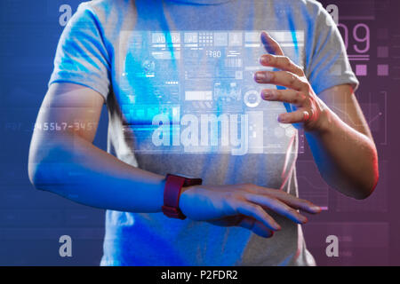 Hands of a young person touching the hologram while creating it Stock Photo