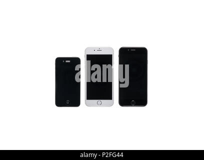 Three smartphones of various sizes with black screens isolated on white Stock Photo
