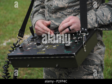 Explosive Ordnance Disposal technicians from the 2nd Civil Engineer Squadron operate the F6A robot using an operating control unit to pilot and control robotic movements and camera systems during training at Barksdale Air Force Base, Louisiana. Exercises simulate improvised explosive device identification and disposal, emphasizing remote operation, team coordination, safety, observation, and operational readiness to protect personnel and infrastructure. Stock Photo