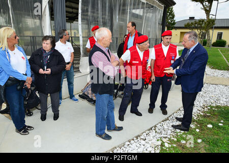 Ivano Trevisanutto, Chief Training Support Center Italy (right), discusses with Delegation of Sovereign Military Order of Malta, during the visit at caserma Ederle, 22 Sept. 2016, Vicenza, Italy. The Sovereign Military Order of Malta (SMOM) or Order of Malta, is a Roman Catholic  Religious Order traditionally of military, chivalrous and noble nature for defense of Catholic faith and assistance to the poor. (U.S. Army photo by Visual Information Specialist Paolo Bovo/Released)