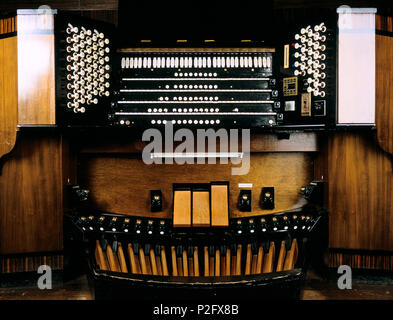 concert organ showing all the registers of keys, stops and pedals. Stock Photo