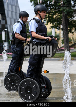 15 June 2018, Germany, Freiburg: Police officers Matthias Engler (L) and Janka Schmidt (R) standing on Segways in downtown Freiburg. The Police in Freiburg will be shortly deploying Segways on a permanent basis. A pilot test started 10 months ago was succesful. Photo: Patrick Seeger/dpa Credit: dpa picture alliance/Alamy Live News Stock Photo