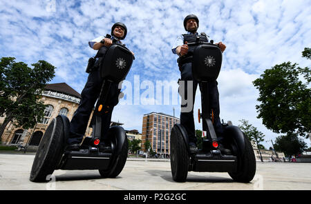 15 June 2018, Germany, Freiburg: Police officers Matthias Engler (R) and Janka Schmidt (L) standing on Segways in downtown Freiburg. The Police in Freiburg will be shortly deploying Segways on a permanent basis. A pilot test started 10 months ago was succesful. Photo: Patrick Seeger/dpa Credit: dpa picture alliance/Alamy Live News Stock Photo