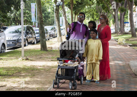 One of an Indian family seen wearing the traditional Malay attire 