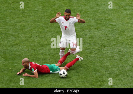 Saint Petersburg, Russia. 15th June, 2018. Iran's Saman Ghoddos (R) in action against Morocco's Morocco's Karim El Ahmadi during the FIFA World Cup 2018 Group B soccer match between Iran and Morocco at the Saint Petersburg Stadium, in Saint Petersburg, Russia, 15 June 2018. Credit: Saeid Zareian/dpa/Alamy Live News Stock Photo