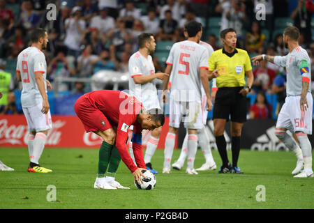 Sochi, Russland. 15th June, 2018. Cristiano RONALDO (POR) puts the ball to the penalty spot, penalty kick, while the Spanish players lament, Portugal (POR) Spain (ESP) 3-3, preliminary round, Group B, game 1, on 15/06/2018 in SOCHI, Fisht Olymipic Stadium. Football World Cup 2018 in Russia from 14.06. - 15.07.2018. | usage worldwide Credit: dpa/Alamy Live News Stock Photo