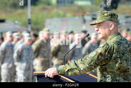 Deputy Commander of the Croatian Army, Brig. Gen. Sinisa Jurkovic speaks during the Immediate Response 16 closing ceremony, Sept. 22, 2016, held at the Eugen Kvaternik training area in Slunj, Croatia. Immediate Response 16 is a multinational, brigade-level command post exercise utilizing computer-assisted simulations and field training exercises spanning two countries, Croatia and Slovenia. The exercises and simulations are built upon a decisive action based scenario and are designed to enhance regional stability, strengthen Allied and partner nation capacity, and improve interoperability amon Stock Photo