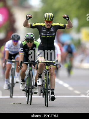 Mitchelton Scott's Sarah Roy celebrates winning as she crosses the finish line during stage three of the OVO Energy Women's Tour from Atherstone to Royal Leamington Spa. Stock Photo