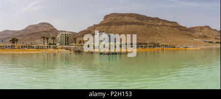 EIN BOKEK, ISRAEL - March 28, 2018: Solar beach with white hotels on the Dead Sea Stock Photo