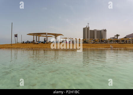 EIN BOKEK, ISRAEL - March 28, 2018: Solar beach with white hotels on the Dead Sea Stock Photo