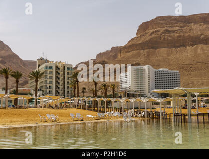 EIN BOKEK, ISRAEL - March 28, 2018: Solar beach with white hotels on the Dead Sea Stock Photo