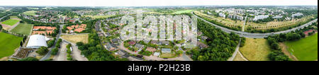 Panorama of aerial photos of a suburb of an industrial city with sports fields and a motorway, high resolution Stock Photo