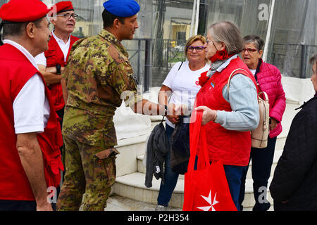 Colonel Umberto D’Andria, Italian Base Commander Caserma Ederle of Vicenza (left), greets Ms. Maria Giulia Medolago Albani, Sovereign Military Order of Malta (right), during the visit at caserma Ederle, 22 Sept. 2016, Vicenza, Italy. The Sovereign Military Order of Malta (SMOM) or Order of Malta, is a Roman Catholic  Religious Order traditionally of military, chivalrous and noble nature for defense of Catholic faith and assistance to the poor. (U.S. Army photo by Visual Information Specialist Paolo Bovo/Released)