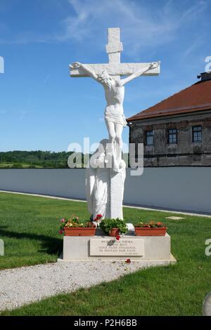 Crucifixion, Virgin Mary under the Cross in front Parish Church of Assumption of the Virgin Mary in Gora, Croatia Stock Photo