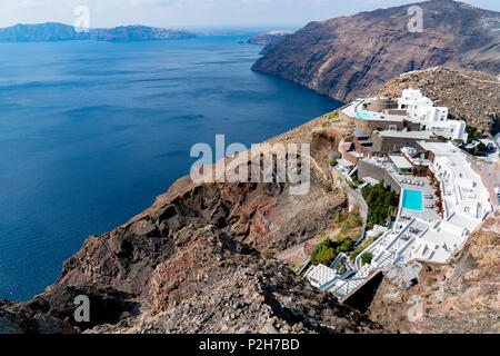 Huge cliff-side mansion with pool in Santorini seaside Stock Photo