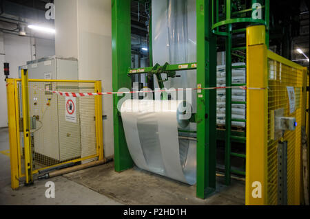 Tobolsk, Russia - July 15. 2016: Sibur company. Polymer plant. Gas-chemical complex on polypropylene production. The machine on packing of finished go Stock Photo