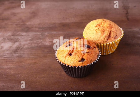 Tasty chocolate cupcakes, muffins on a white wooden table. Stock Photo