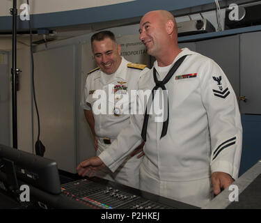 160929-N-KB426-178  SACRAMENTO, Calif. (Sept. 29, 2016) Rear Adm. Douglas 'Woody' Beal, deputy commander of Navy Recruiting Command and flag host of Sacramento Navy Week, observes Petty Officer 2nd Class Nate Ward, assigned to Navy band Southwest, “The Destroyers,” during a performance at the Powerhouse Science Center. Navy Weeks focus a variety of assets, equipment and personnel on a single city for a week-long series of engagements designed to bring America's Navy closer to the people it protects, in cities that do not have a large naval presence. (U.S. Navy photo by Petty Officer 3rd Class  Stock Photo