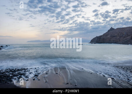 Beach Playa de Caleta in twilight with the view to Teide and Tenerife, La Gomera, Canary islands Stock Photo