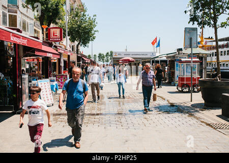 Istanbul, June 17, 2017: Local residents are walking along the street in the Kadikoy district. Ordinary city life or everyday affairs. Stock Photo
