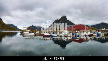 Fishing boats at the port of Reine village on Lofoten islands in Norway Stock Photo