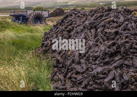 Mound of dry turf at Peat Bog, Renard County Kerry Ireland Stock Photo