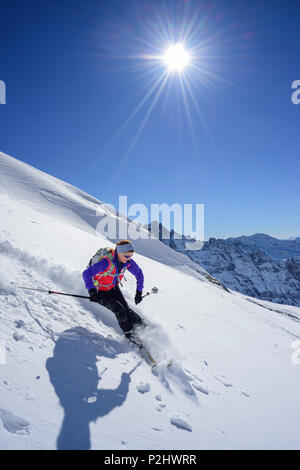Woman back-country skiing downhill from Kleiner Kaserer, Kleiner Kaserer, valley of Schmirn, Zillertal Alps, Tyrol, Austria Stock Photo