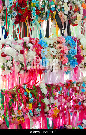 Colorful Crowns for Sale Made of Fake Flowers Stock Photo