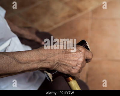 Old Thin Woman Right Hand Holding on Walking Cane Stock Photo