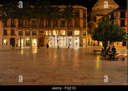 Palm trees and people on the Plaza de la Constitucion at night, Malaga, Andalusia, Spain, Europe Stock Photo