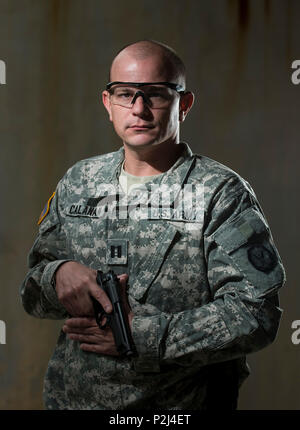 Capt. Andrew Callanan, a U.S. Army Reserve military police officer with the 535th Military Police Battalion, of Cary, North Carolina, poses for a portrait during the Active Shooter Threat Response Training taught at an Army Reserve installation in Nashville, Tennessee, on Sept. 29. This image was digitally manipulated in post-production. (U.S. Army Reserve photo by Master Sgt. Michel Sauret) Stock Photo