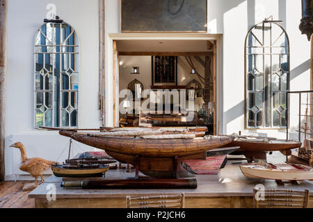 Architects model ships hulls with 1890’s Crittal windows in Sussex barn conversion Stock Photo