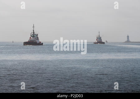 Crowley Maritime Tractor Tugs ADMIRAL And MASTER, Leaving The Los Angeles Main Channel In The Port Of Los Angeles, San Pedro, California, USA. Stock Photo