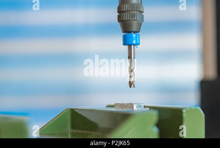 Processing of the plastic workpiece on CNC milling machine Stock Photo