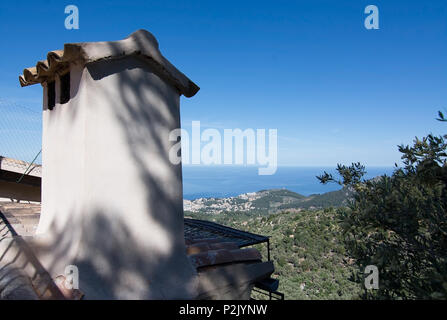 Small roof detail with tiled roof and ocean view in Tramuntana mountains between Soller and Cala Tuent, Mallorca, Spain. Stock Photo