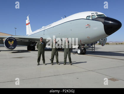 From left to right: Master Sgt. Aaron Ray, Senior Master Sgt. Scott Scurlock, and Tech. Sgt. Colin Wernecke of the 370th Flight Test Squadron pose for a photo in front of a KC-135 Stratotanker test aircraft. (U.S. Air Force photo by Kenji Thuloweit) Stock Photo