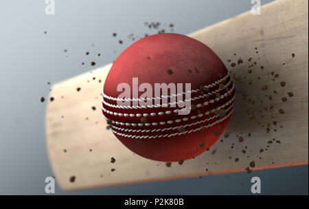 An extreme closeup slow motion action capture of a red cricket ball striking a wooden bat with dirt particles emanating on a dark isolated background  Stock Photo