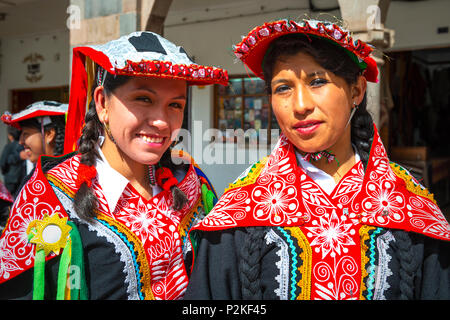 Portrait of two indigenous Quechua women in traditional clothing during ...