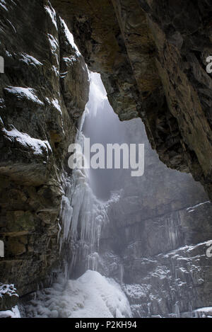View from Breitachklamm to steep rock walls in Winter with snowfall and icicles, Obersdorf, Germany 2014 Stock Photo