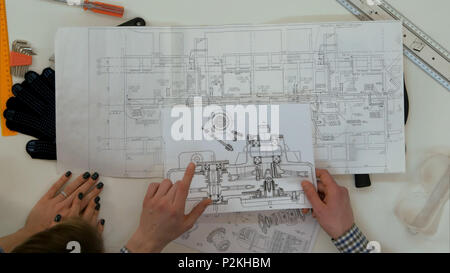 Young architects working on blueprints Stock Photo