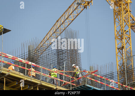 BUCHAREST, ROMANIA - JUNE 14, 2018: Workers on a construction site Stock Photo